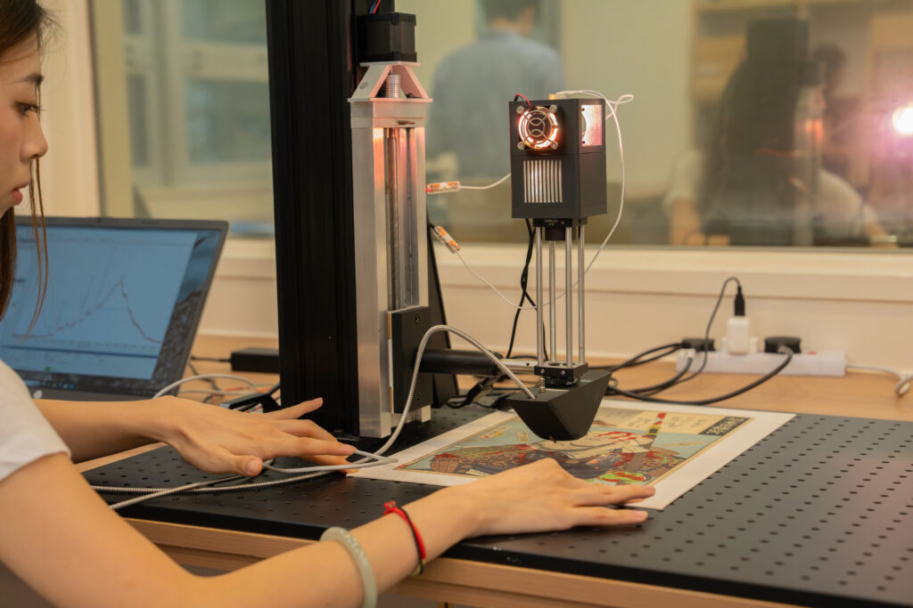 A student uses an AI-powered tool to perform analysis on a sample work of art. 